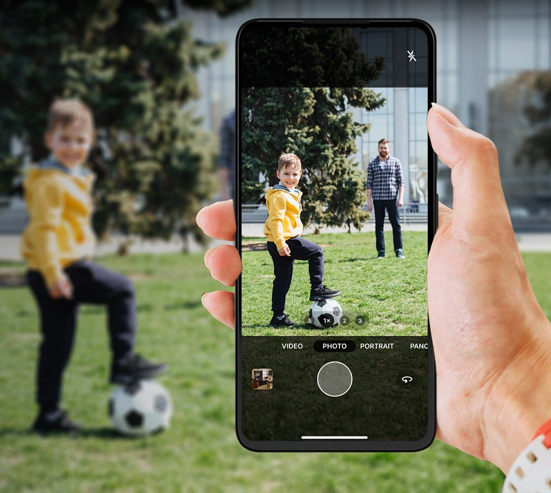 Framing a shot on the UP Phone camera in a park.